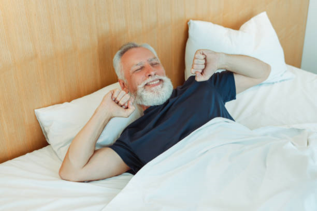 senior man waking up refreshed